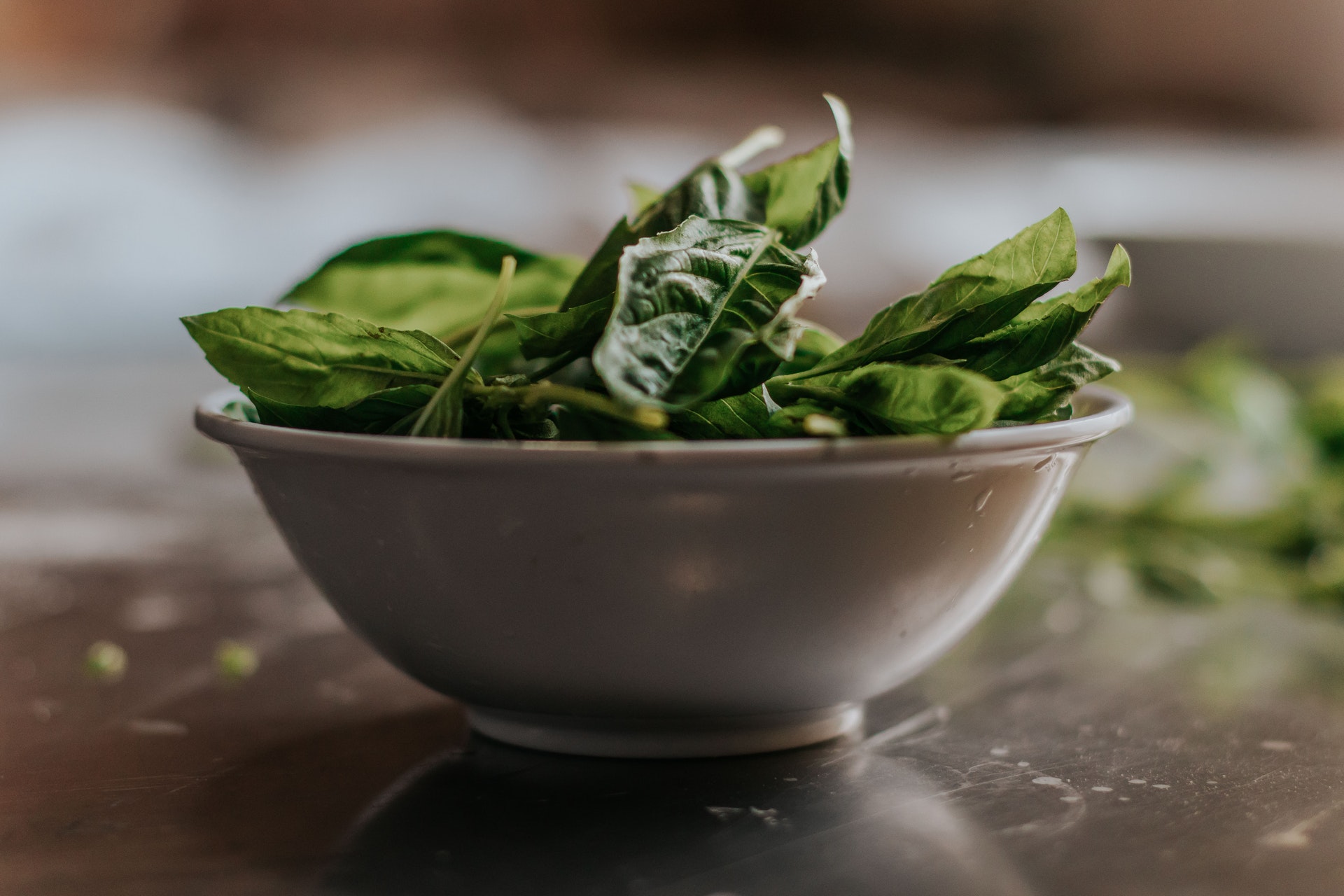 bowl of spinach on a table