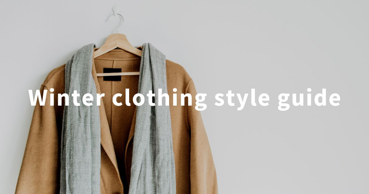 Coat and scarf with 'winter clothing style guide' text in white as a blog banner