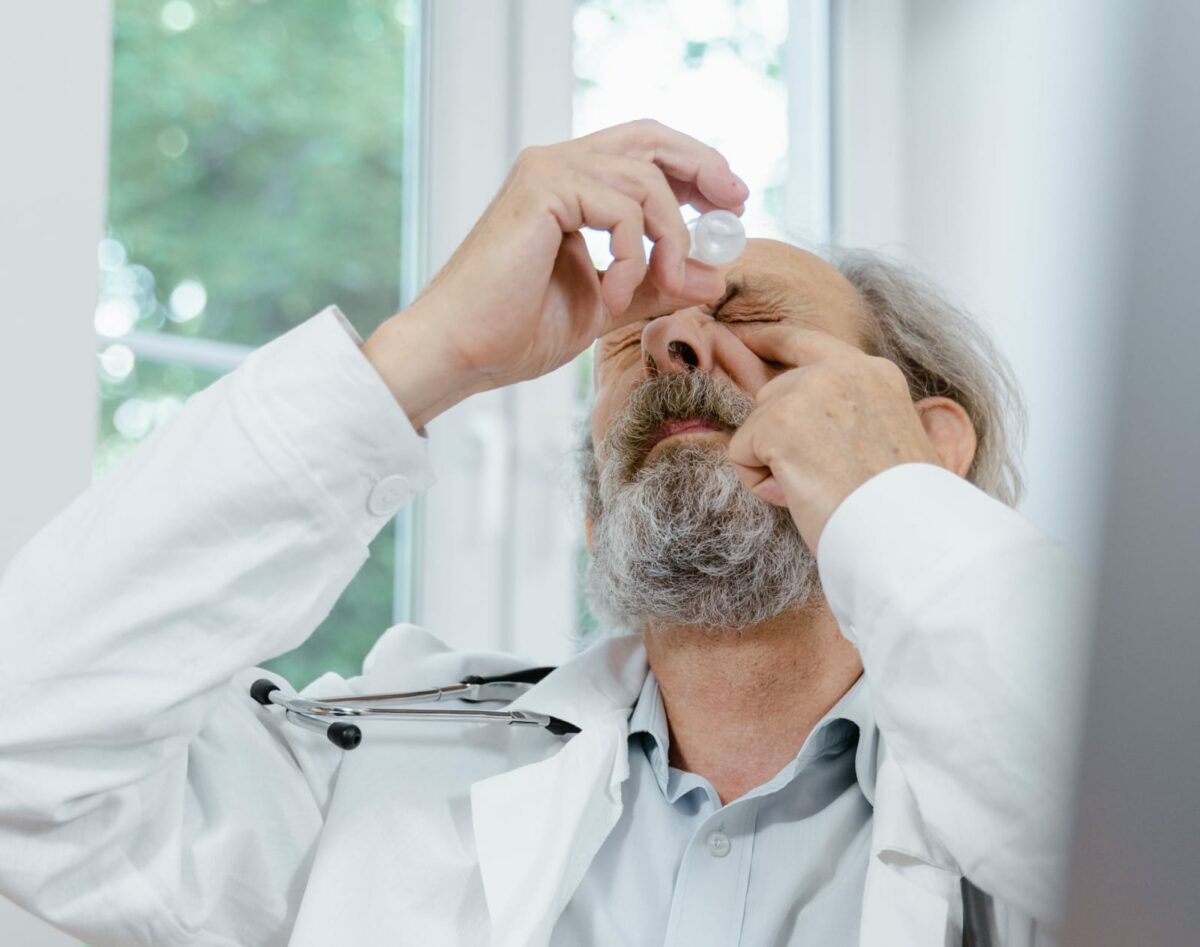 doctor using eyedrops